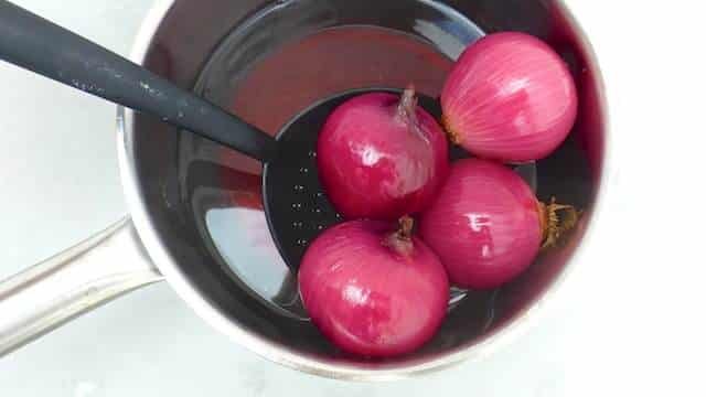 Roasted Red Onions: poached in port wine, grilled and sprinkled with fresh thyme... Roasted Red Onions: poached in port wine, grilled and sprinkled with fresh thyme...
