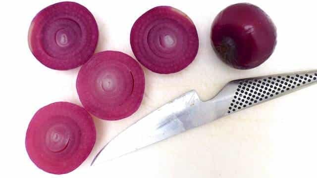 Roasted Red Onions: poached in port wine, grilled and sprinkled with fresh thyme... Roasted Red Onions: poached in port wine, grilled and sprinkled with fresh thyme...